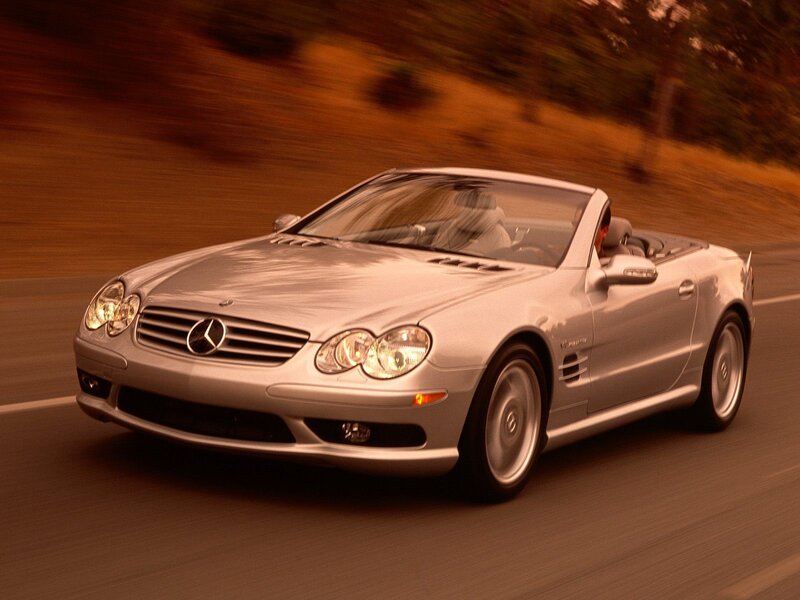Silver Mercedes-Benz SL500 driving