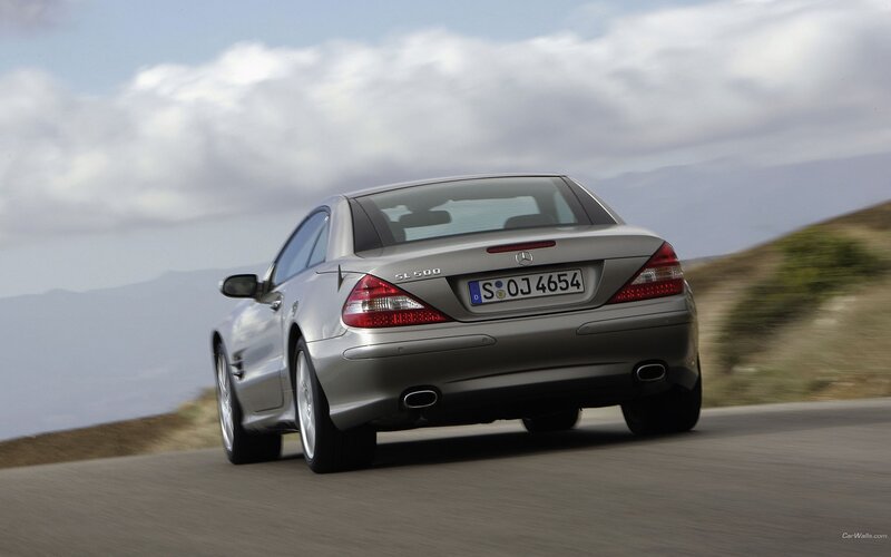 silver mercedes-benz sl500 driving