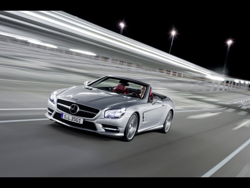 Silver Mercedes-Benz SL500 driving at night