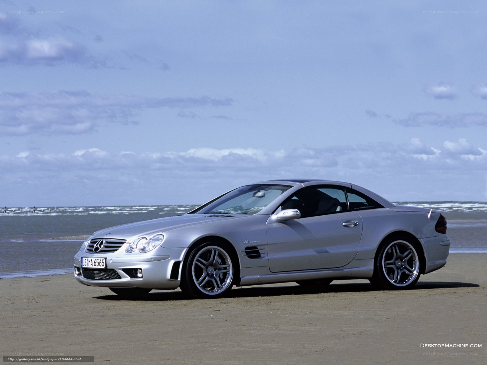 Silver Mercedes-Benz SL55 AMG on beach