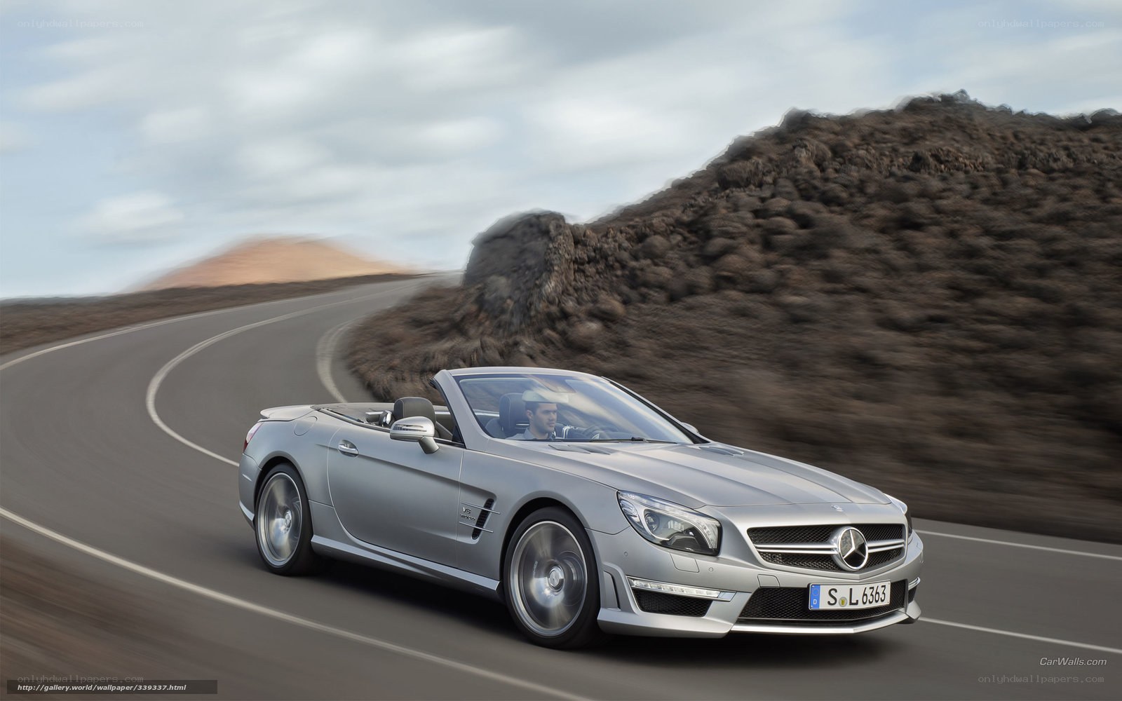 silver mercedes-benz sl550 driving