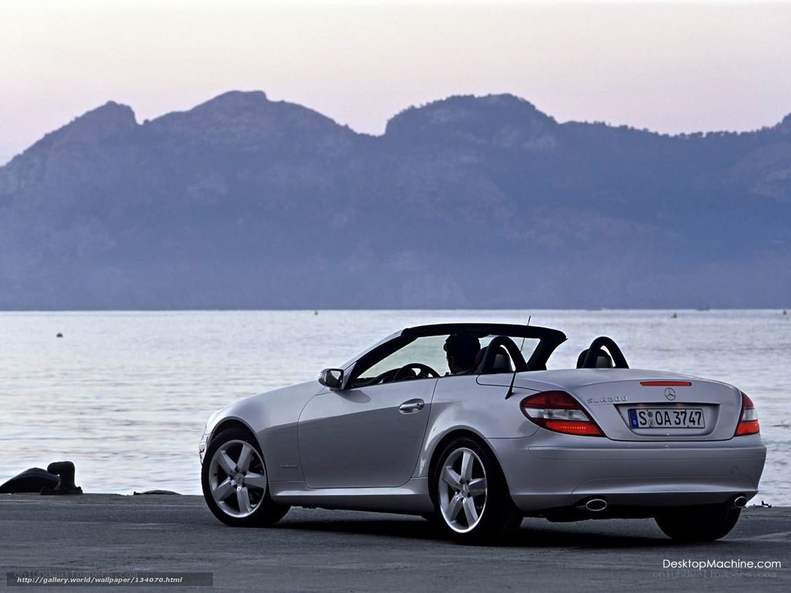 Silver Mercedes-Benz SLK by the sea