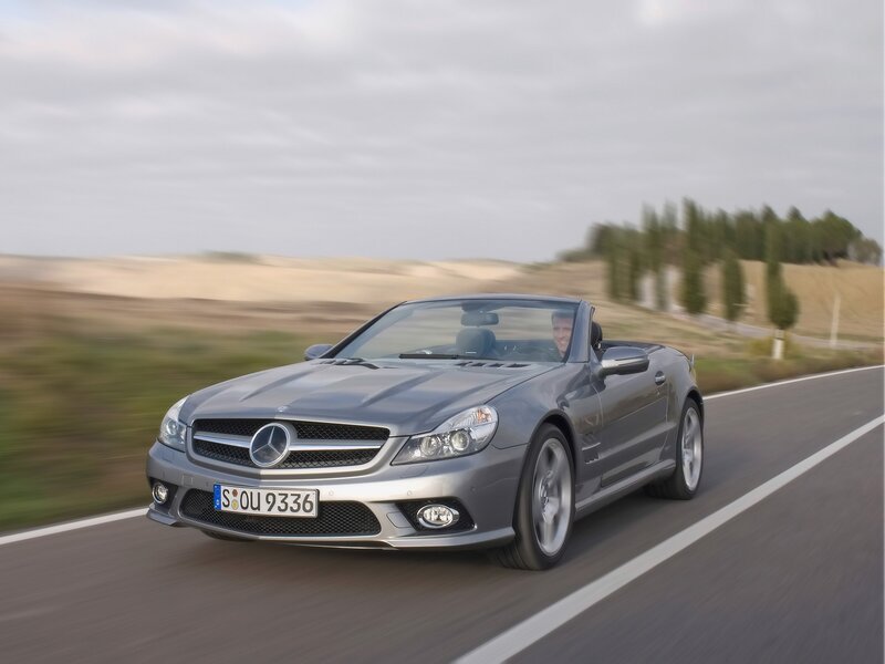 Silver Mercedes-Benz SLK driving on road