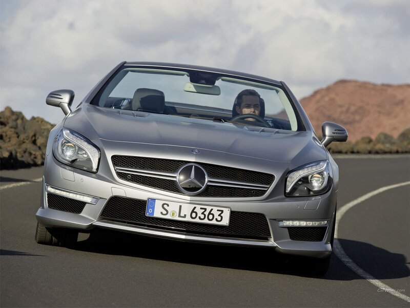 Silver Mercedes-Benz SLK driving on road