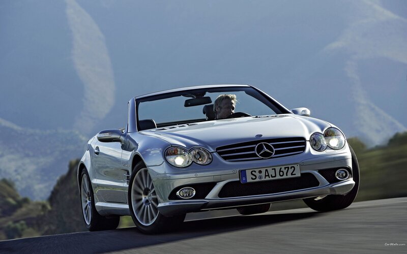 Silver Mercedes-Benz SLK driving on road