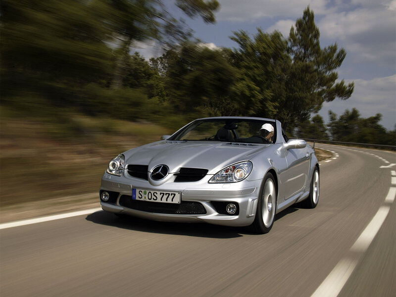 Silver Mercedes-Benz SLK driving on road
