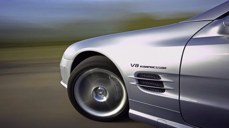 silver mercedes-benz slk in motion