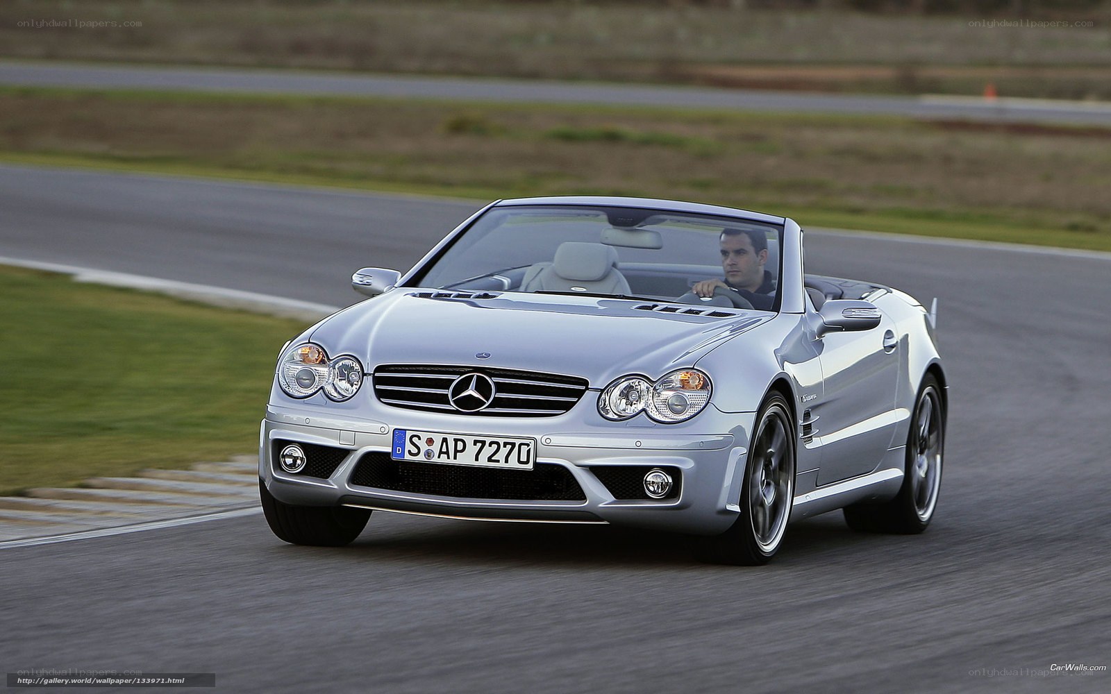 Silver Mercedes-Benz SLK on a racetrack