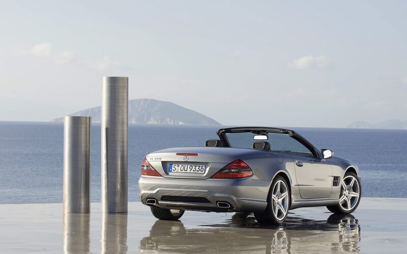 Silver Mercedes-Benz SLK parked by the sea