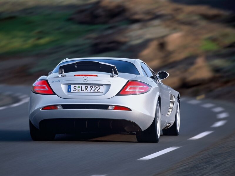 Silver Mercedes-Benz SLR driving on road