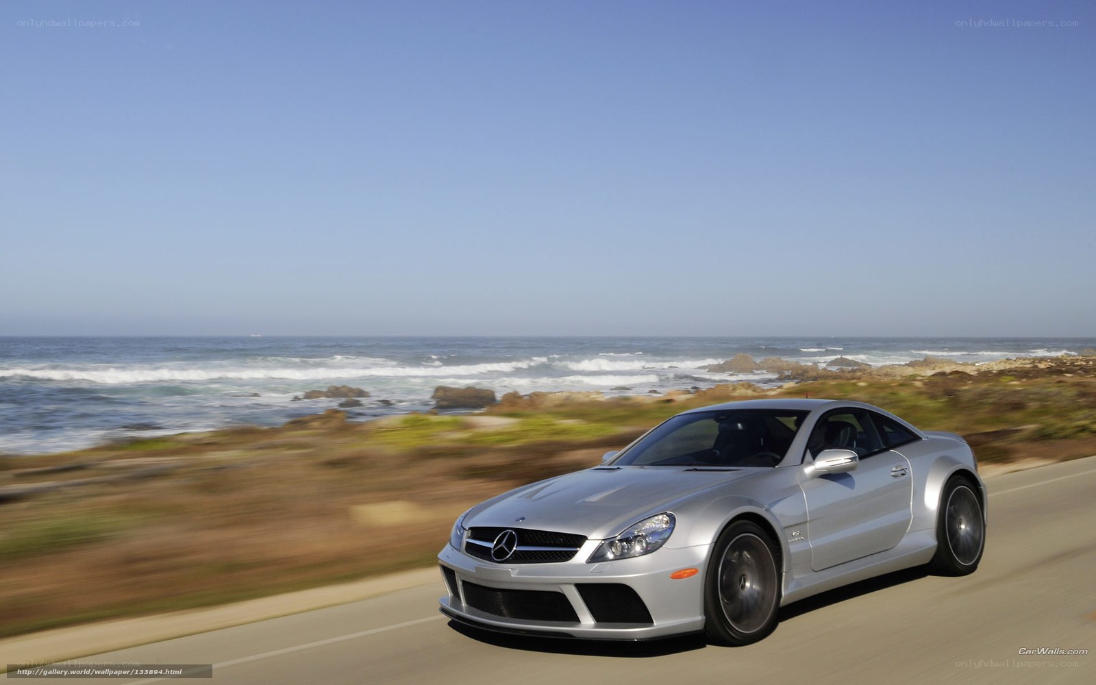 Silver Mercedes-Benz SLR on coastal road