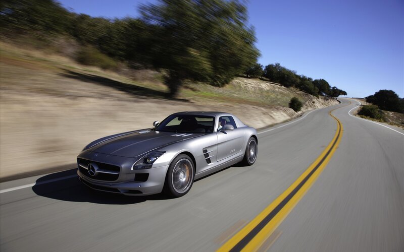 Silver Mercedes-Benz SLS AMG driving