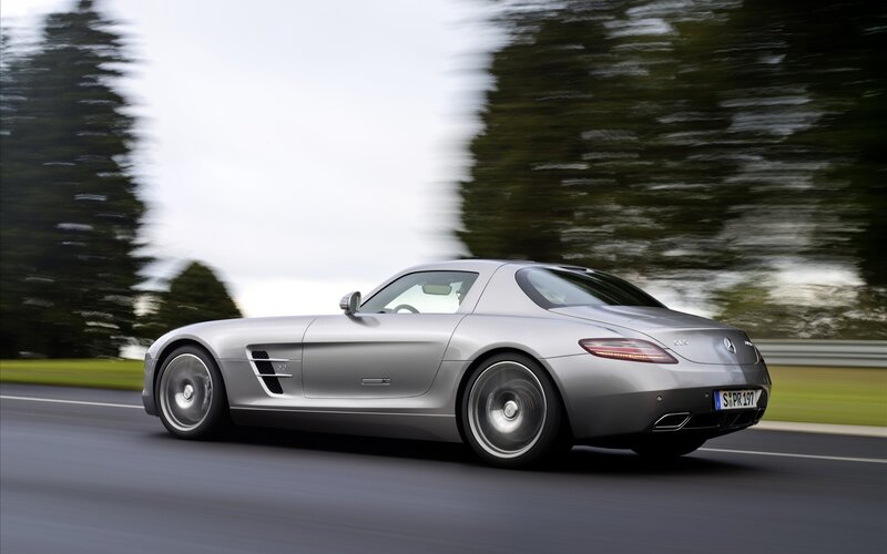 silver mercedes-benz sls amg in motion