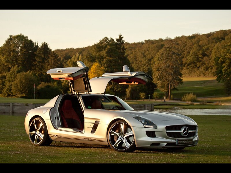 Silver Mercedes-Benz SLS AMG on a golf course