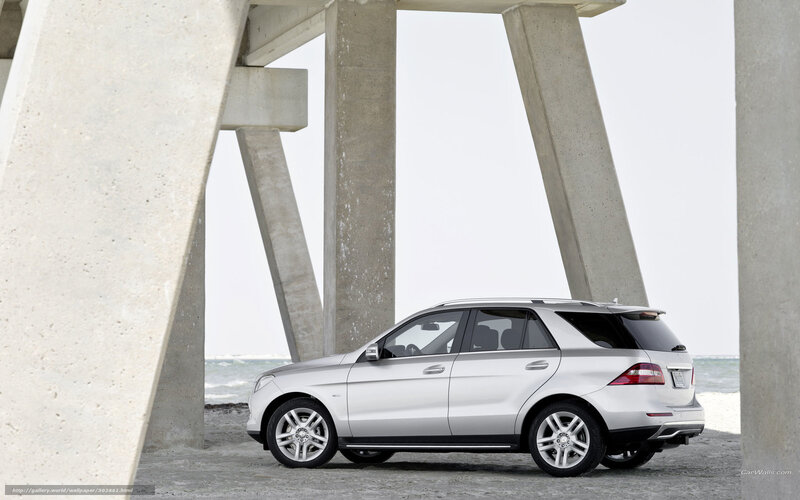 Silver Mercedes-Benz SUV at beach