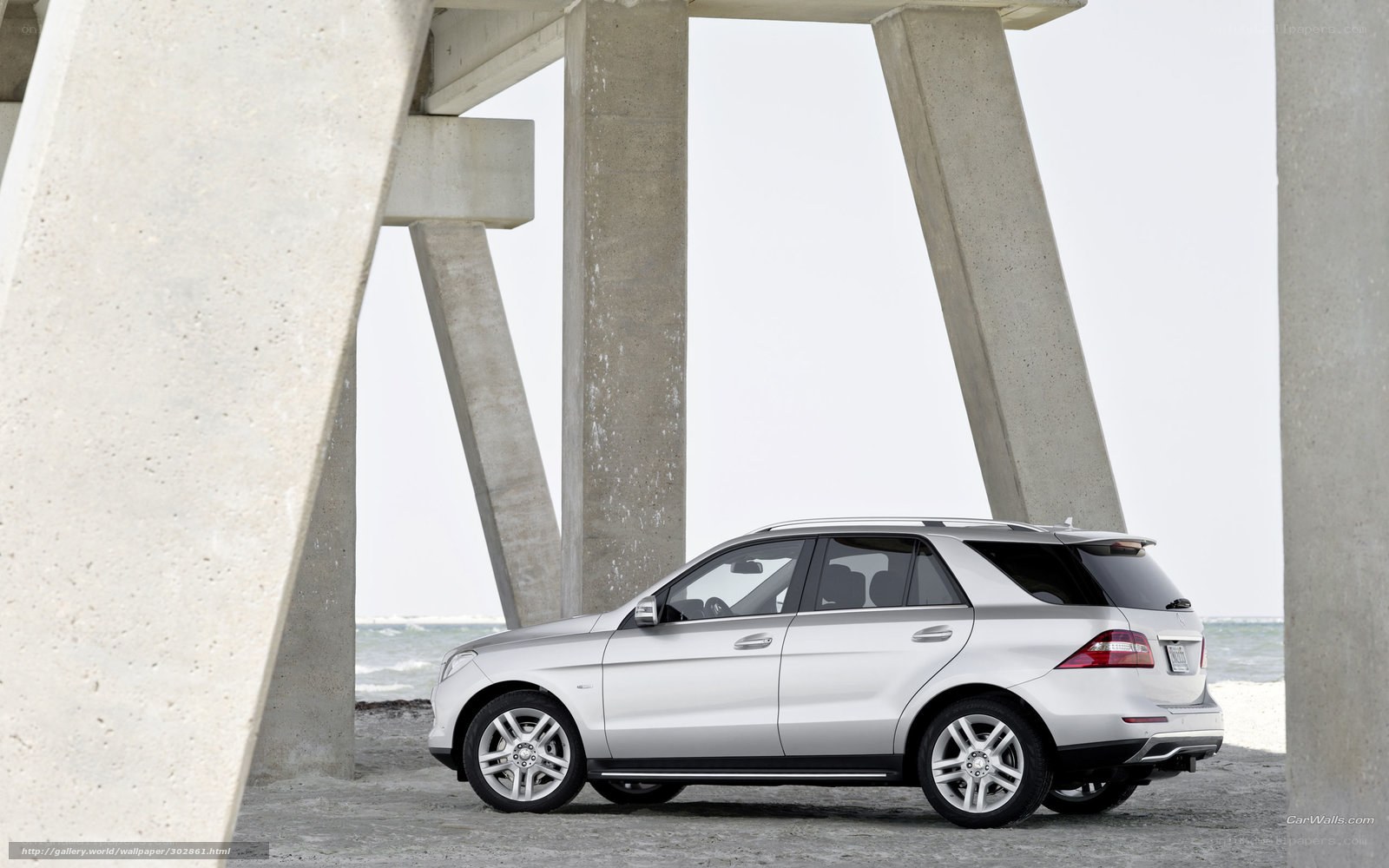 Silver Mercedes-Benz SUV at beach