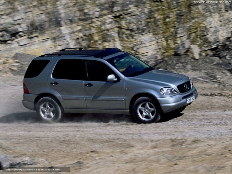 silver mercedes-benz suv driving