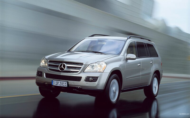 silver mercedes-benz suv in motion