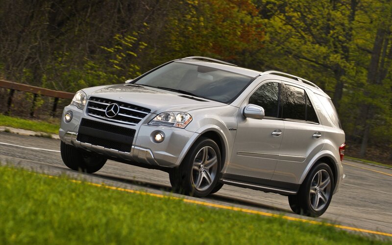 silver mercedes-benz suv on road