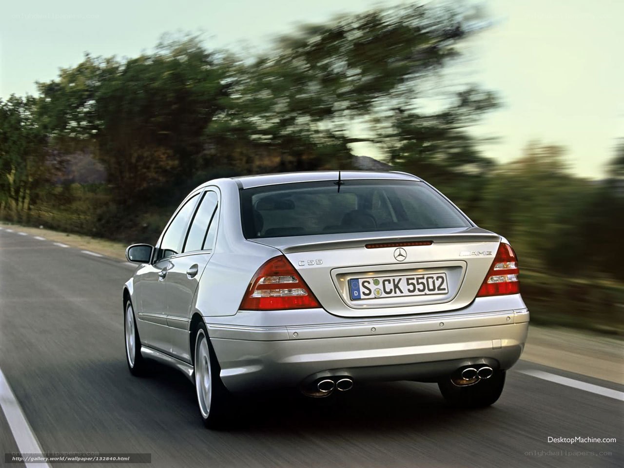 silver mercedes c55 amg in motion