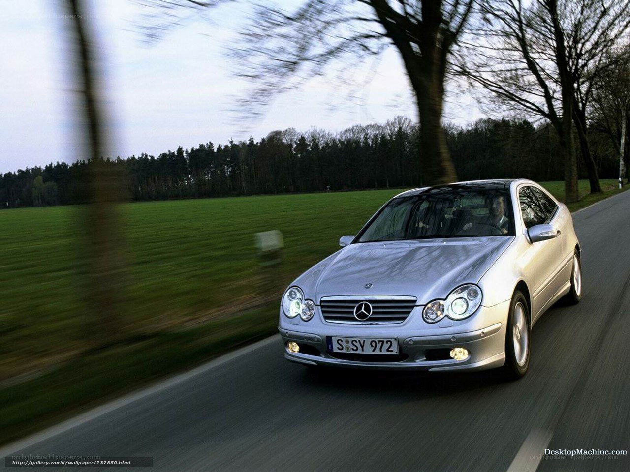 silver mercedes driving on country road