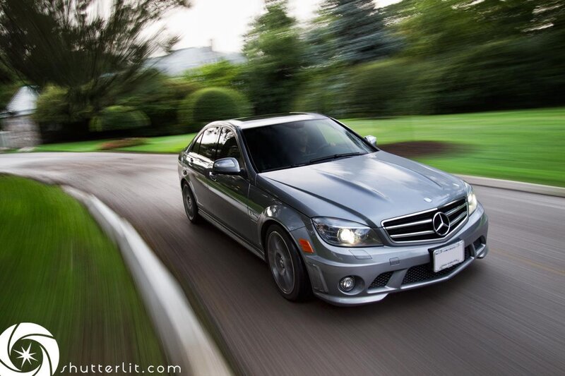 silver mercedes driving on road