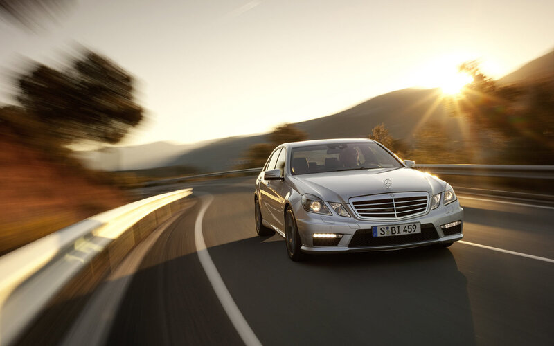 silver mercedes driving on road