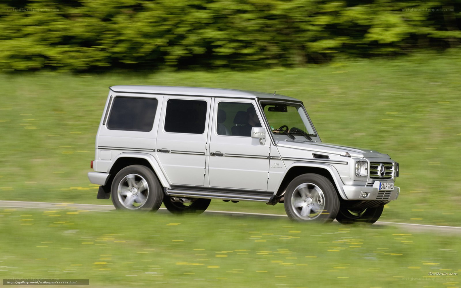silver mercedes g-wagon driving