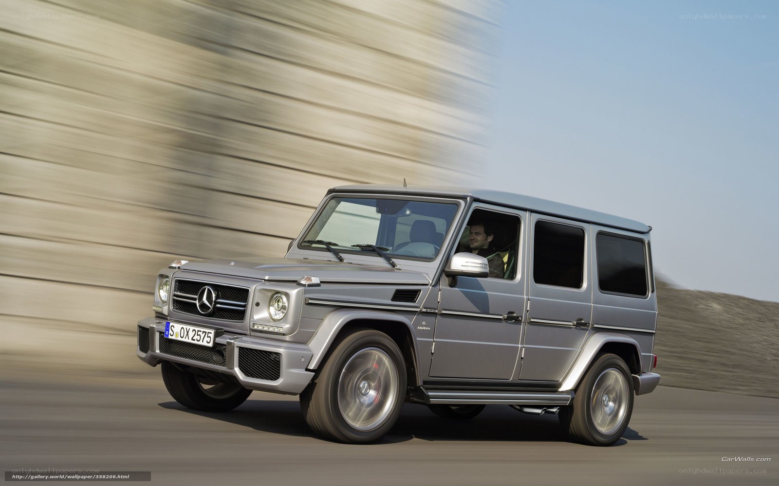 silver mercedes g-wagon in motion