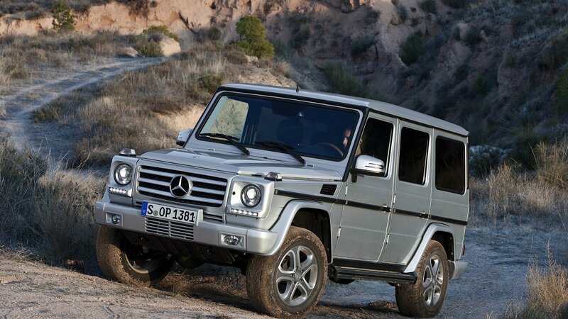 Silver Mercedes G-Wagon on dirt road