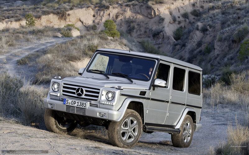 Silver Mercedes G-Wagon on dirt road