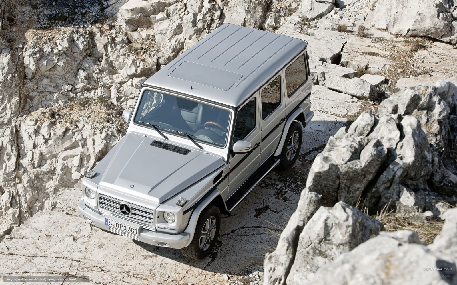 Silver Mercedes G-Wagon on rocky terrain