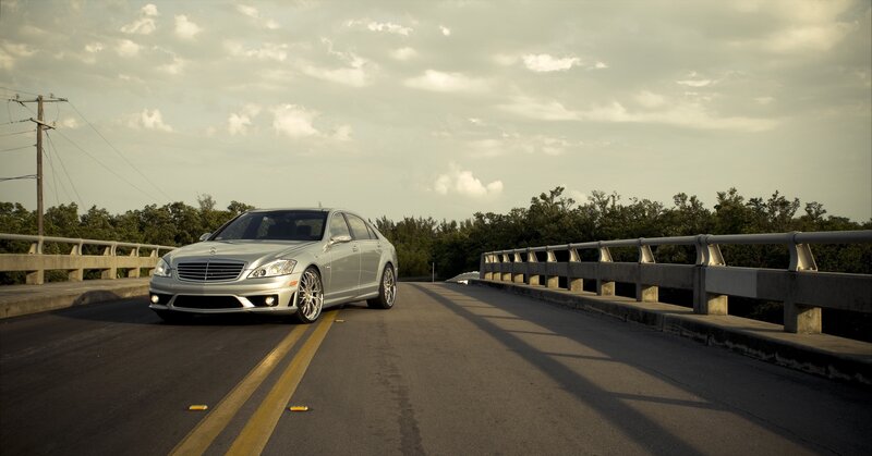 Silver Mercedes on a bridge
