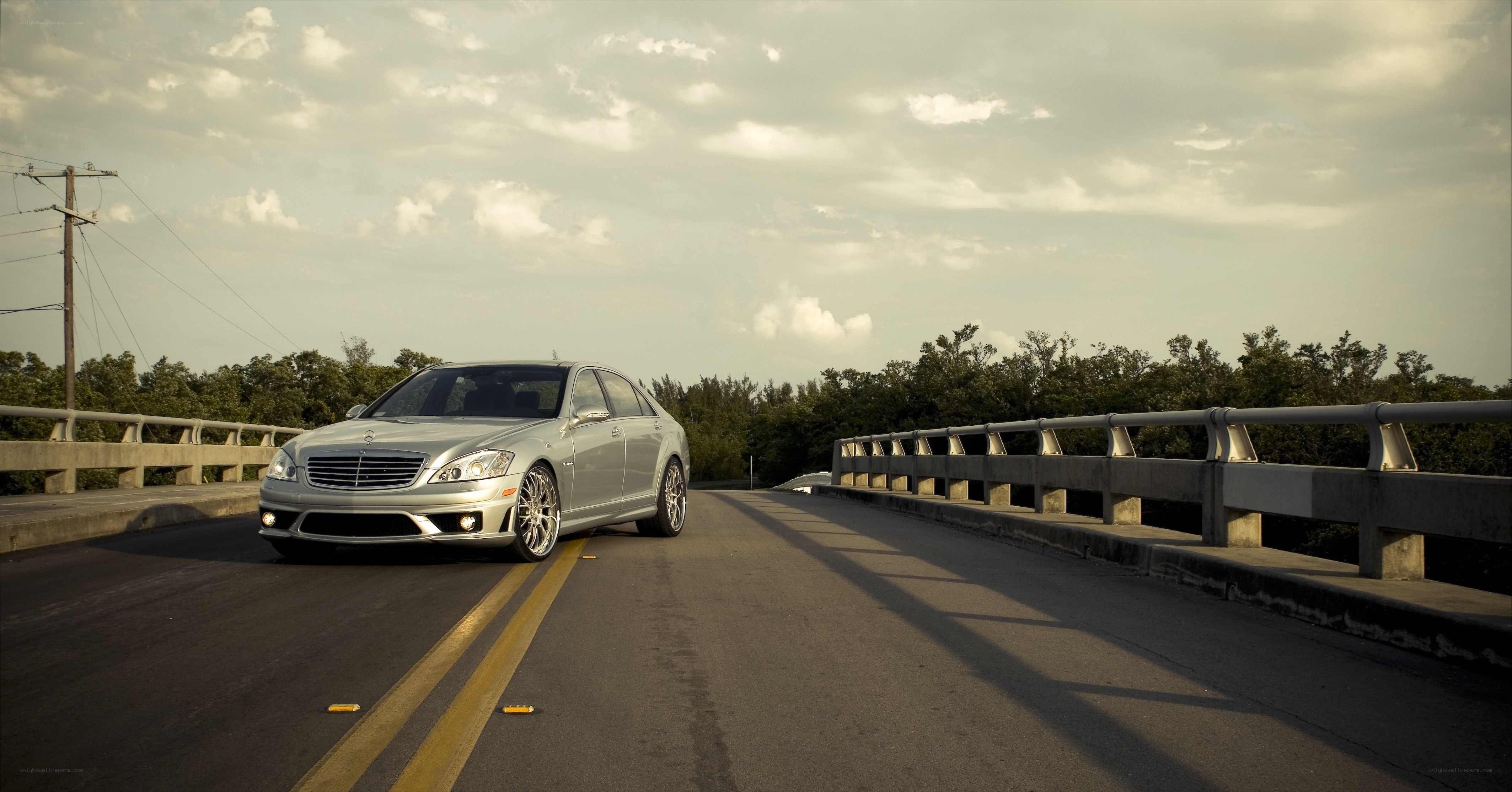 Silver Mercedes on a bridge