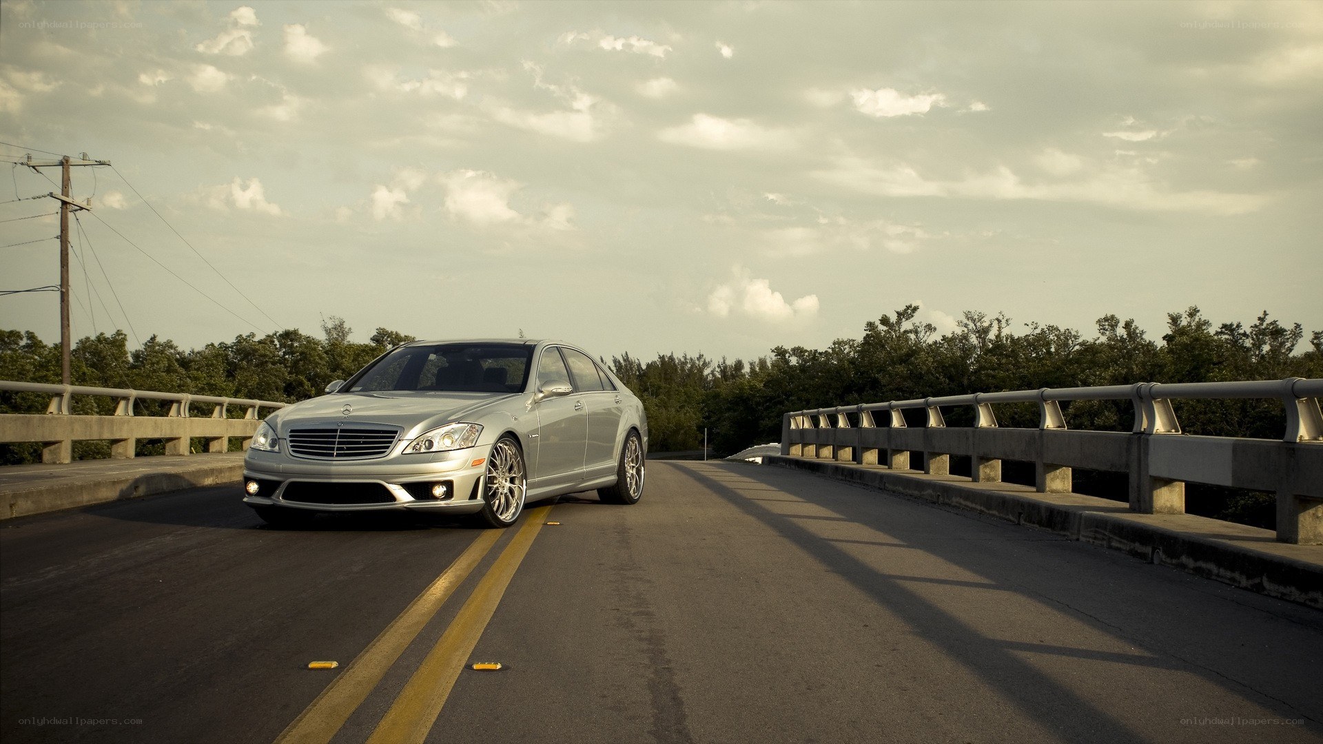 silver mercedes on a bridge
