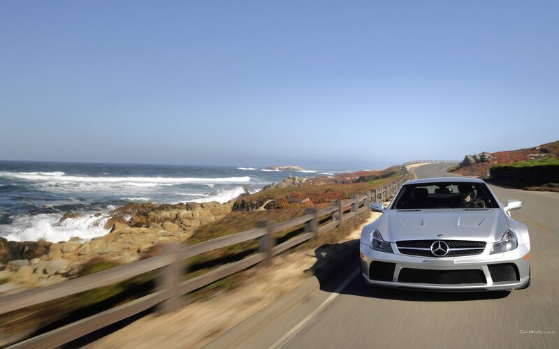 Silver Mercedes on coastal road