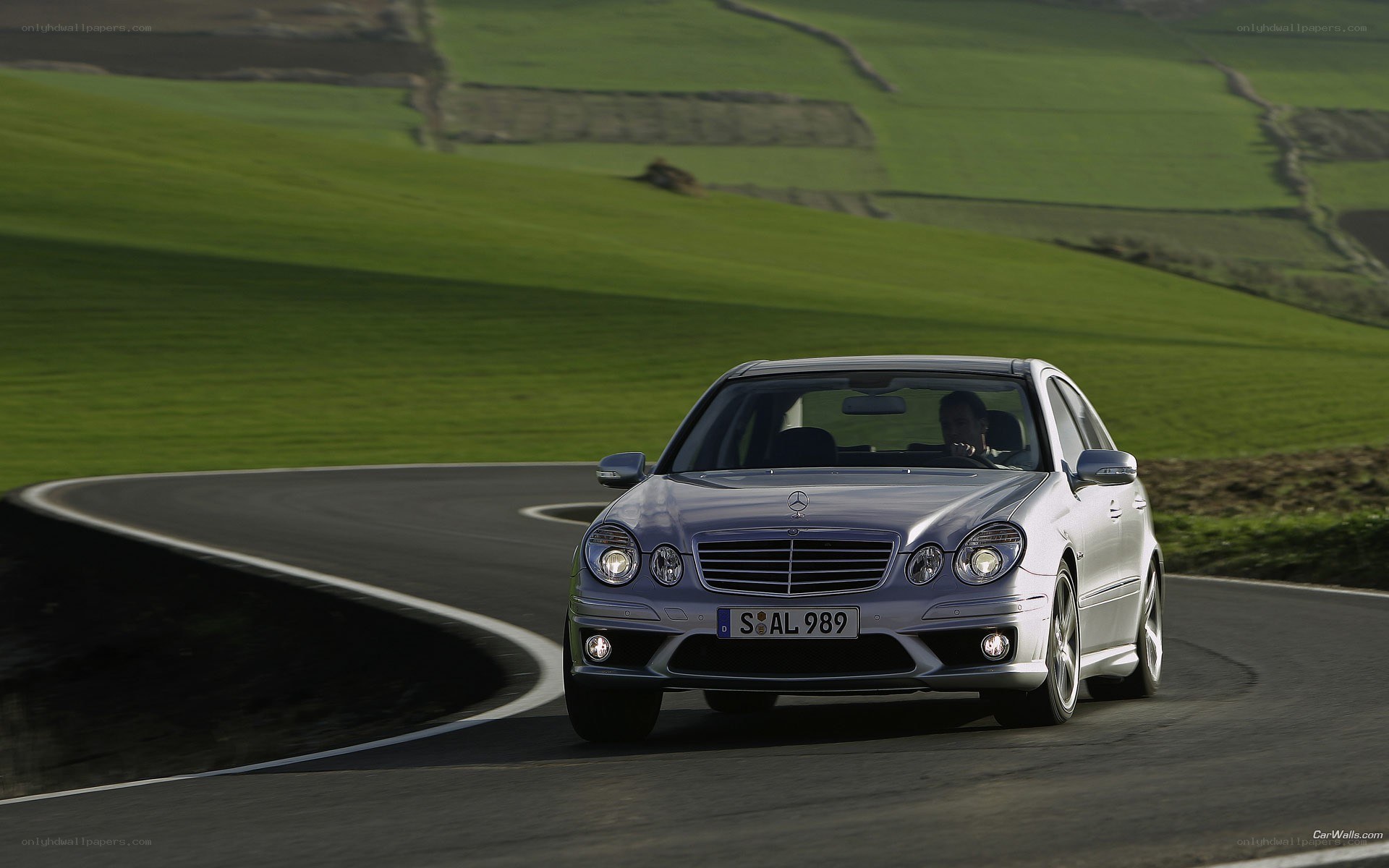 silver mercedes on winding road
