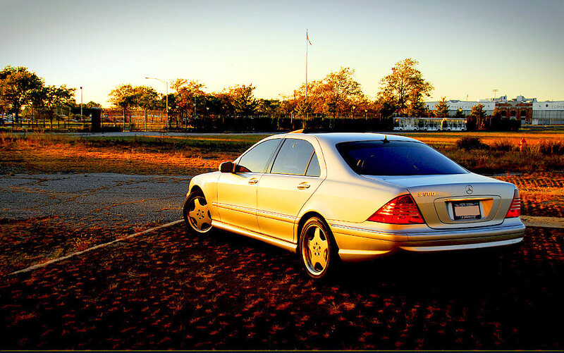 silver mercedes s500 at sunset