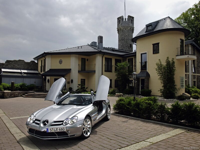 Silver Mercedes SLR McLaren at a castle