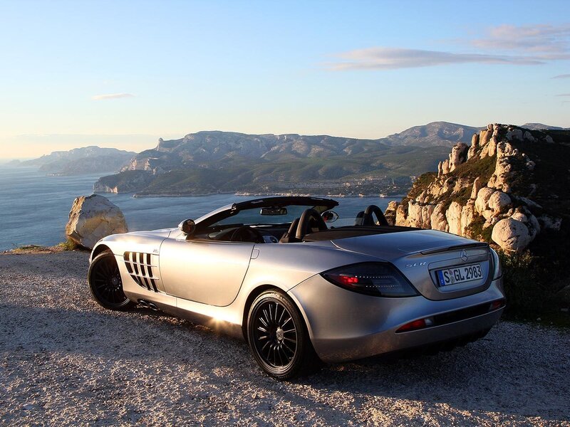 Silver Mercedes SLR on a cliff