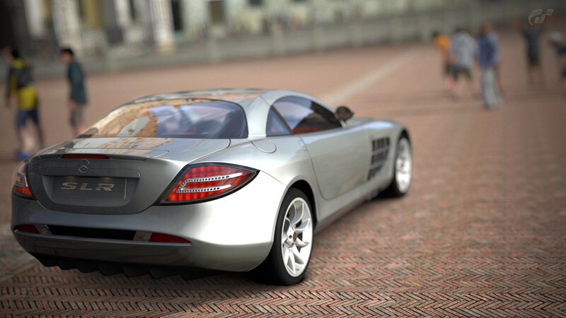 Silver Mercedes SLR on brick street