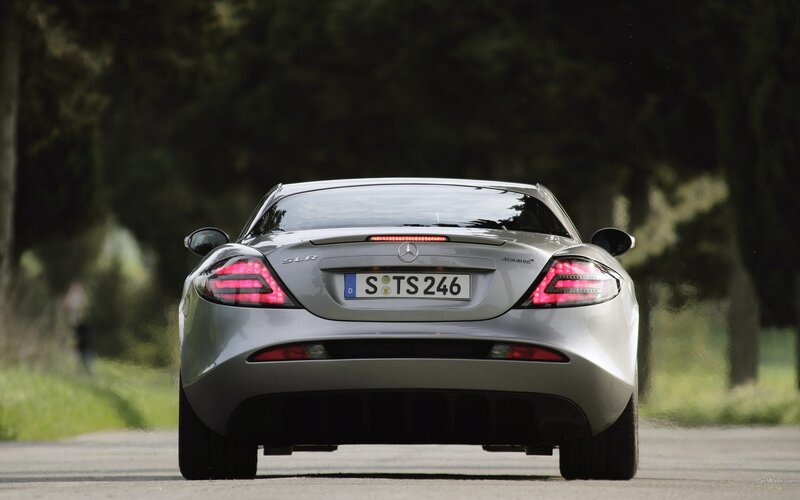 silver mercedes slr on road