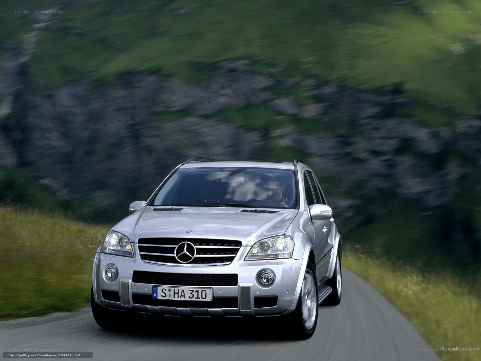 silver mercedes suv on mountain road