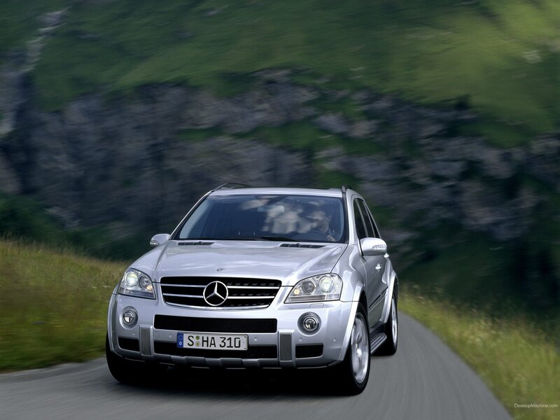 silver mercedes suv on mountain road