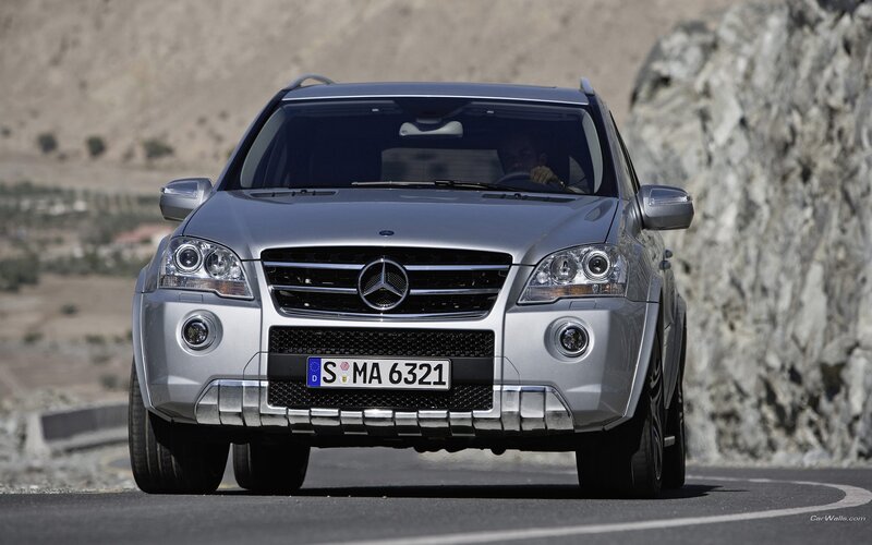 silver mercedes suv on mountain road