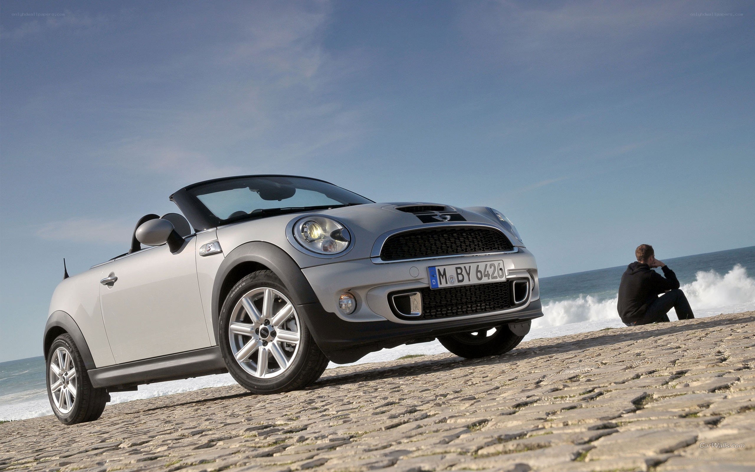 Silver MINI convertible on beach