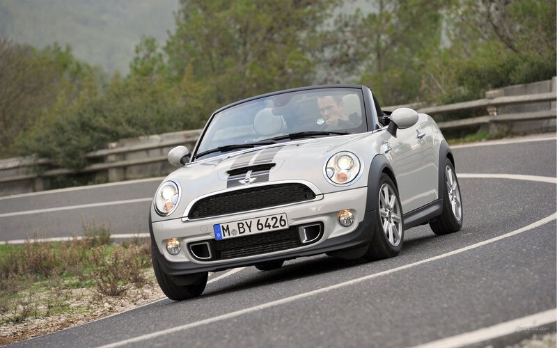silver mini convertible on road