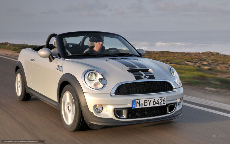Silver MINI Cooper convertible driving
