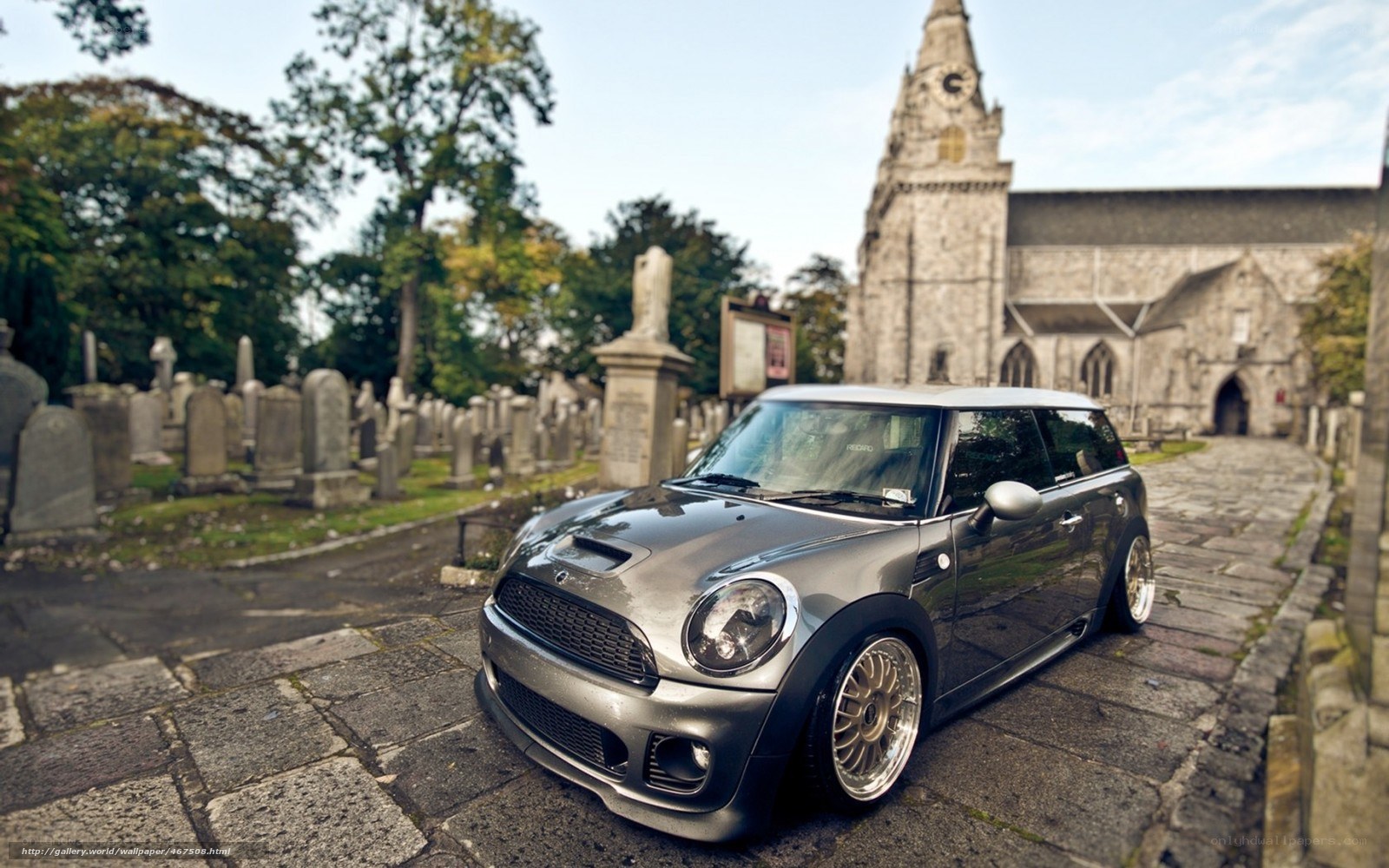 Silver Mini Cooper in a cemetery