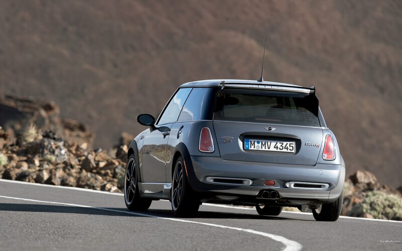 silver mini cooper on mountain road